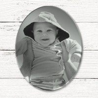 Laat een ovale spiegel graveren met een baby foto